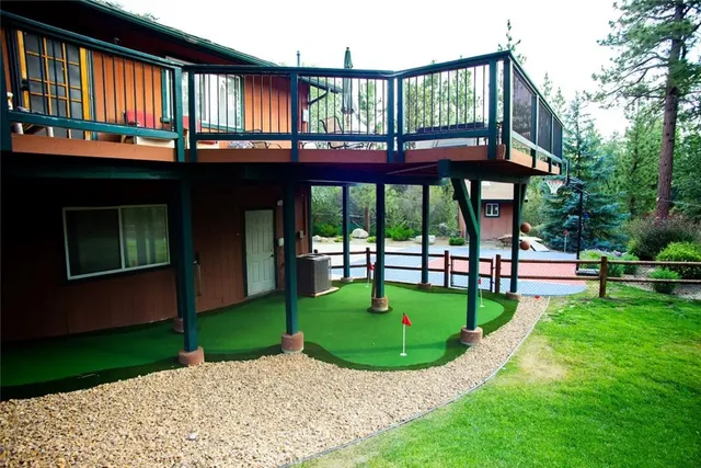 a view of a chair and table in the garden