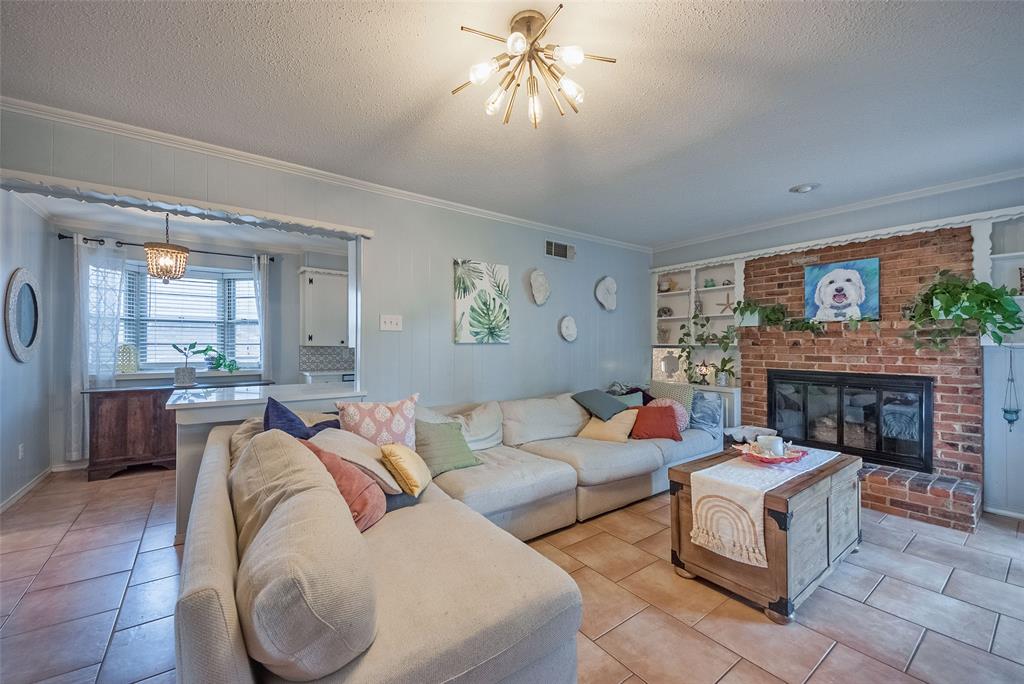 5739 Banting Way Dallas, TX 75227 - Photo 6 of 15 a living room with furniture and a fireplace