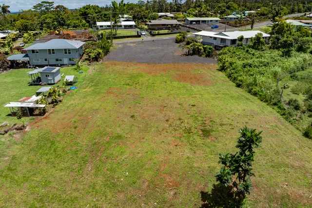a view of a swimming pool and lounge chairs