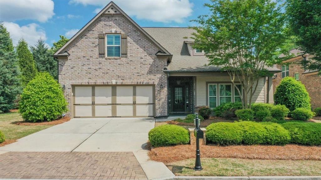 4485 Brighton Place Cumming, GA 30040 - Photo 1 of 1 a front view of a house with garden