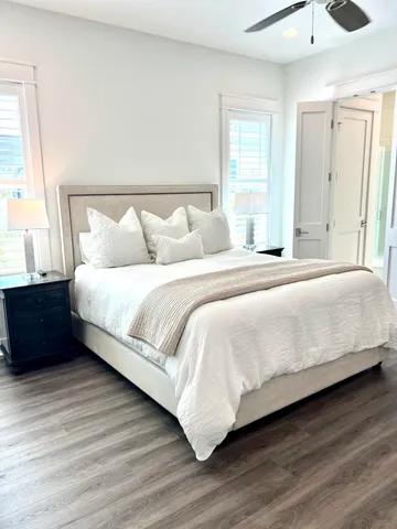 a bedroom with a bed and a night stand