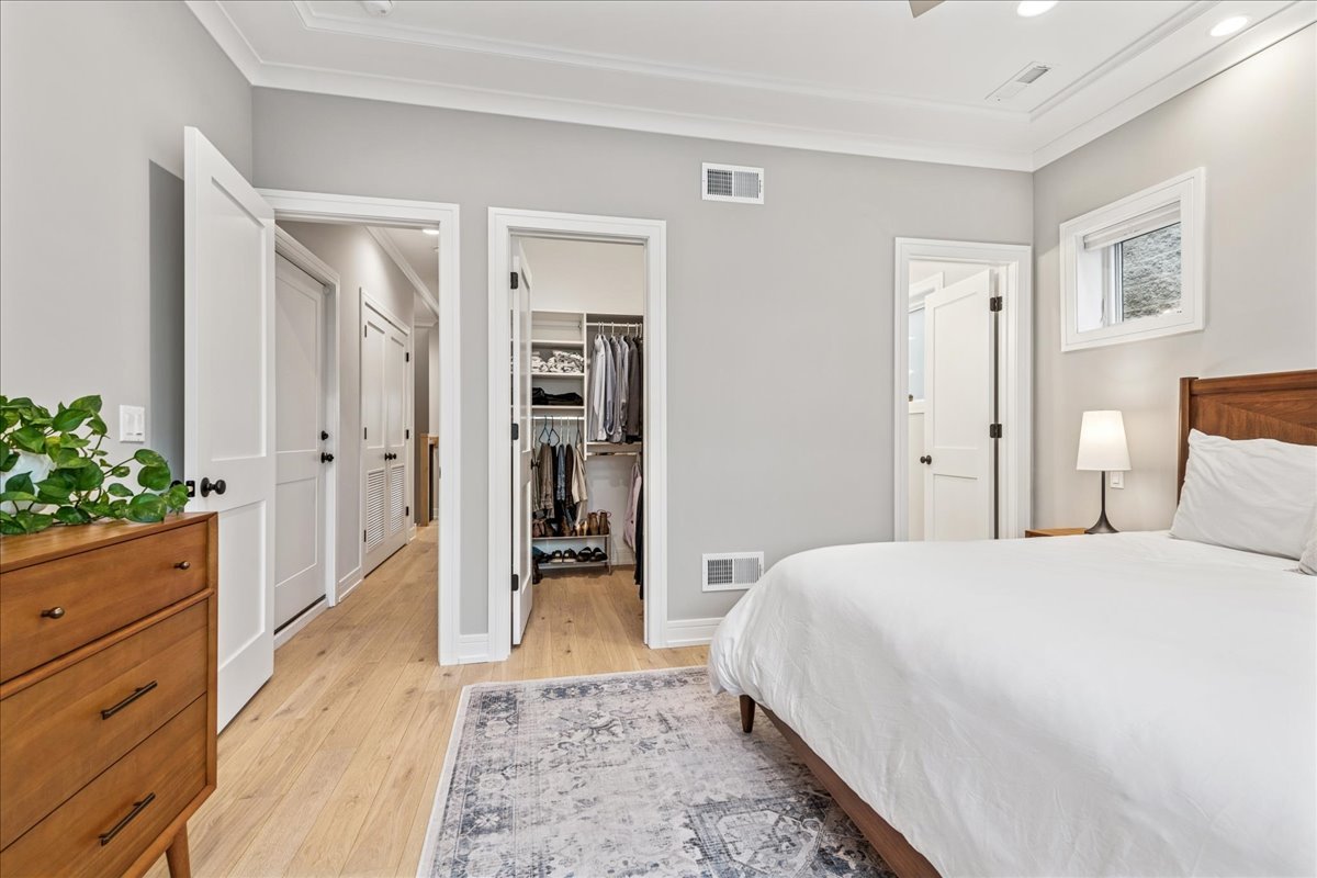 1922 West Belmont Avenue, Unit 3 Chicago, IL 60657 - Photo 19 of 29 a spacious bedroom with a bed and a dresser