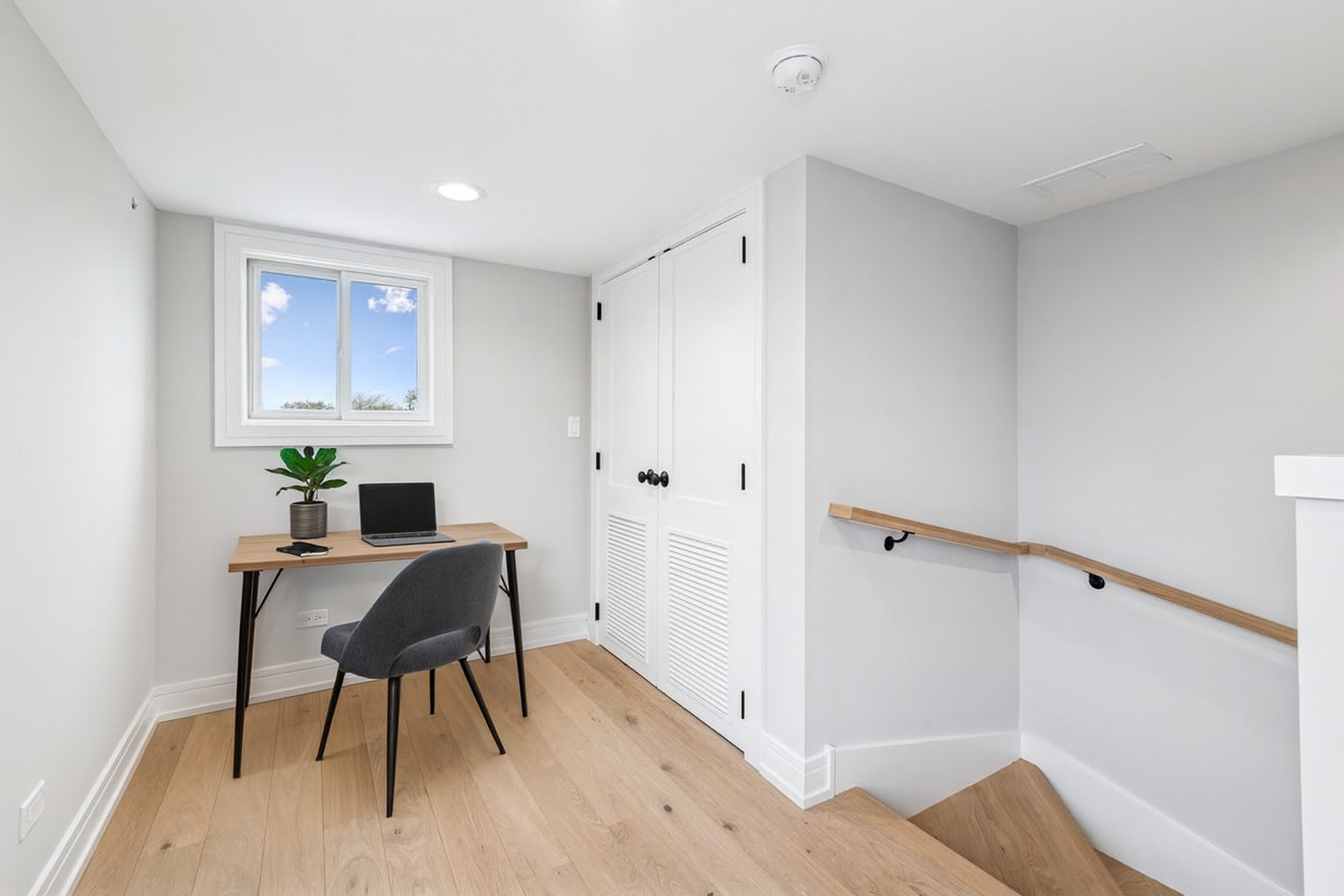 1922 West Belmont Avenue, Unit 3 Chicago, IL 60657 - Photo 23 of 29 a workspace with furniture and wooden floor