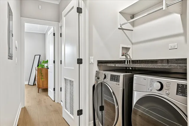 a view of a hallway with washer and dryer