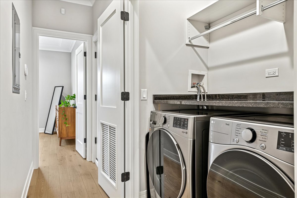 1922 West Belmont Avenue, Unit 3 Chicago, IL 60657 - Photo 24 of 29 a view of a hallway with washer and dryer