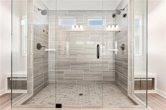 a bathroom with a glass door shower