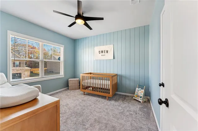 a bathroom with a double vanity sink toilet and a tub