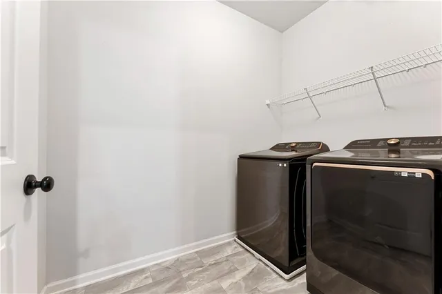 a living room with furniture a flat screen tv and a floor to ceiling window