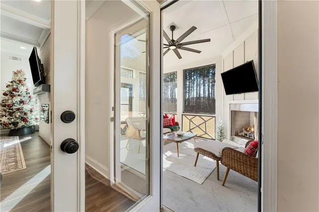 a living room with furniture fireplace and a flat screen tv