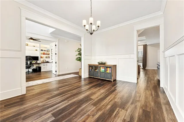 a view of a room with wooden floor