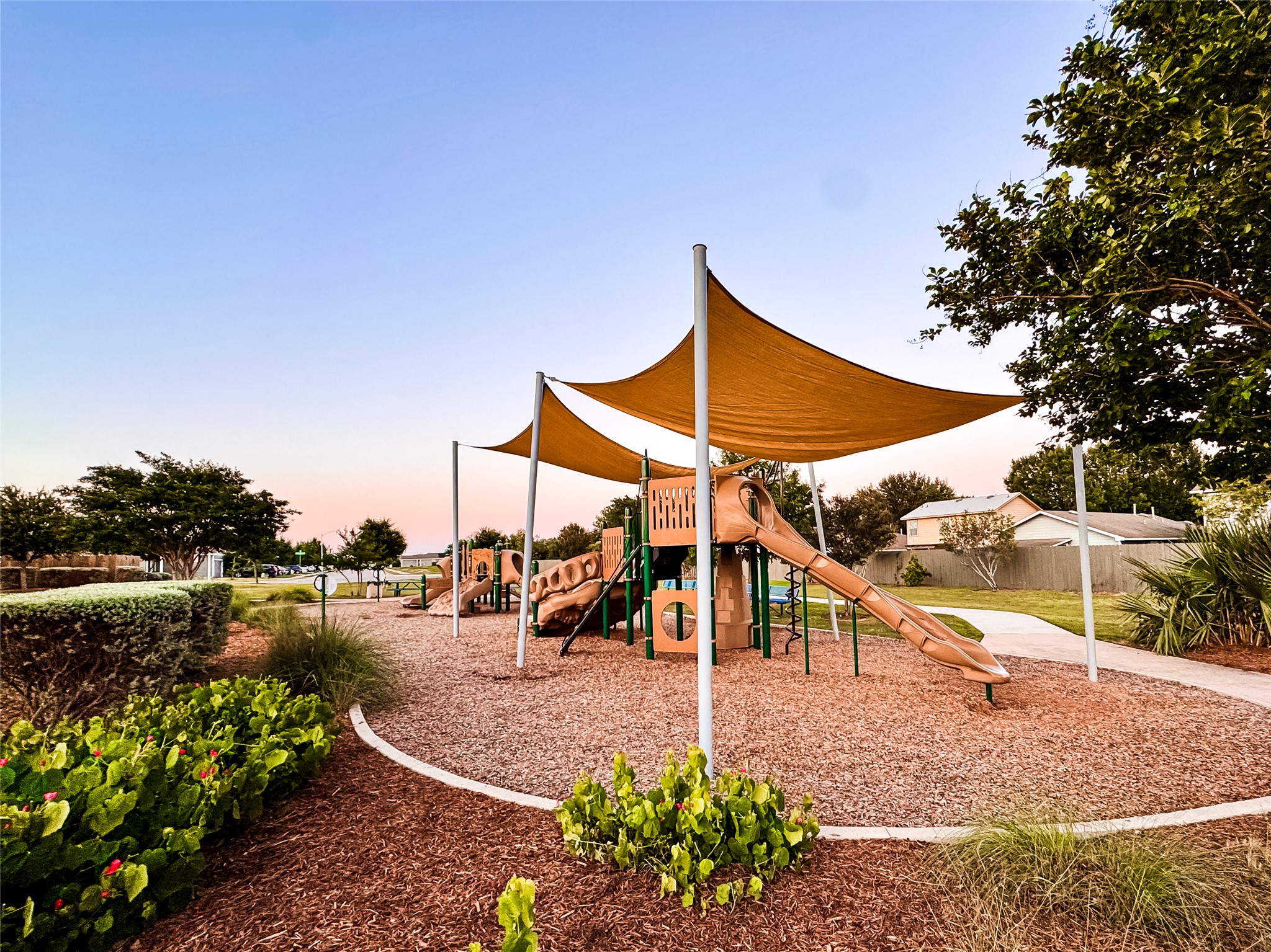 6905 Vail Ridge Street Austin, TX 78744 - Photo 32 of 39 Community playground with shade structures