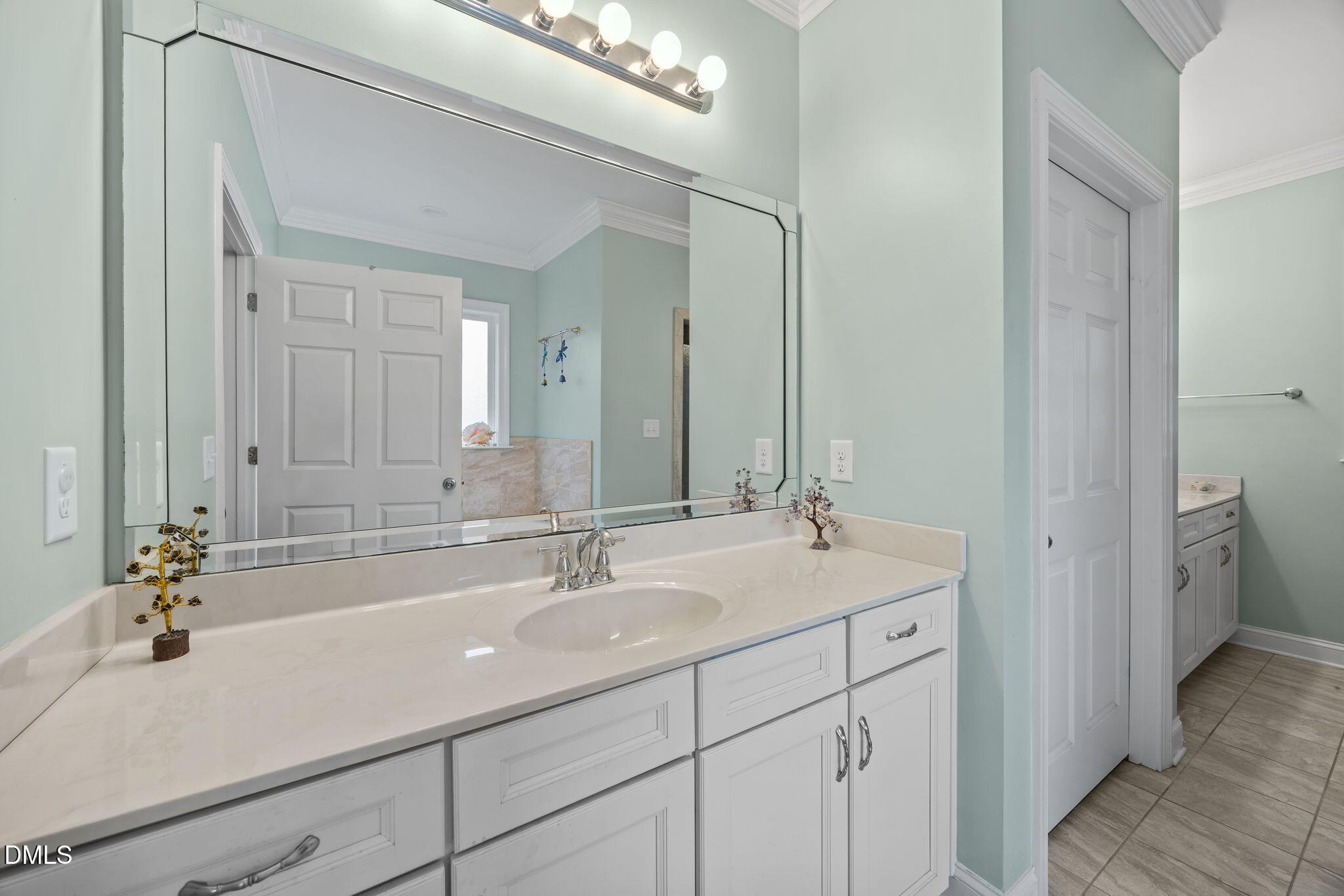 2880 Elevation Road Four Oaks, NC 27524 - Photo 38 of 51 a bathroom with a sink and a mirror