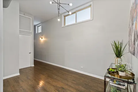 a view of room with window and wooden floor