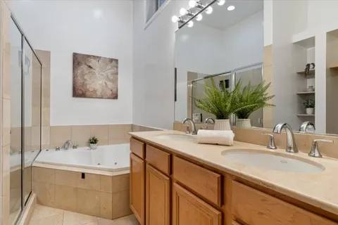 a bathroom with a sink double vanity and a mirror