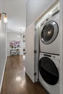 a view of a hallway with washer and dryer