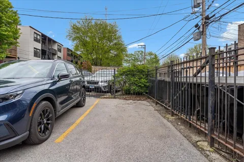 a view of a garage and car parked