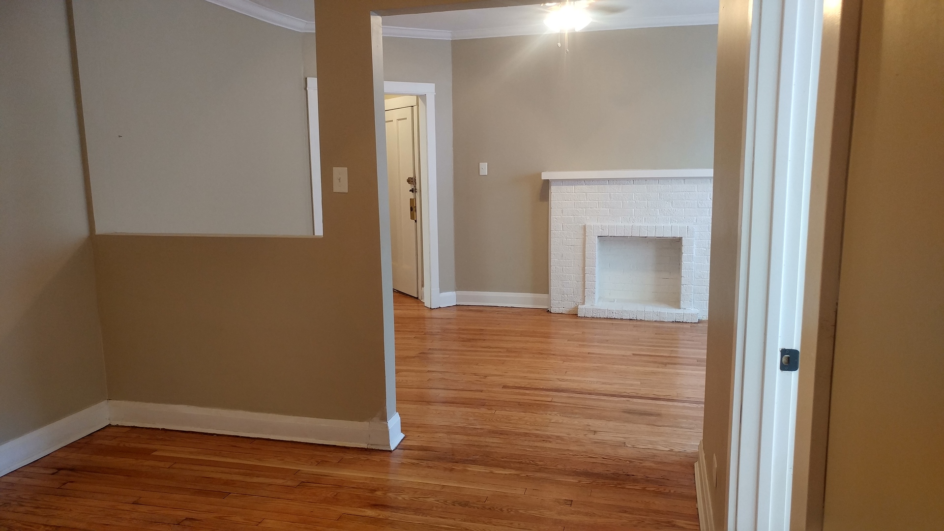 416 East 110th Street, Unit 3 Chicago, IL 60628 - Photo 4 of 7 a view of a hallway with wooden floor