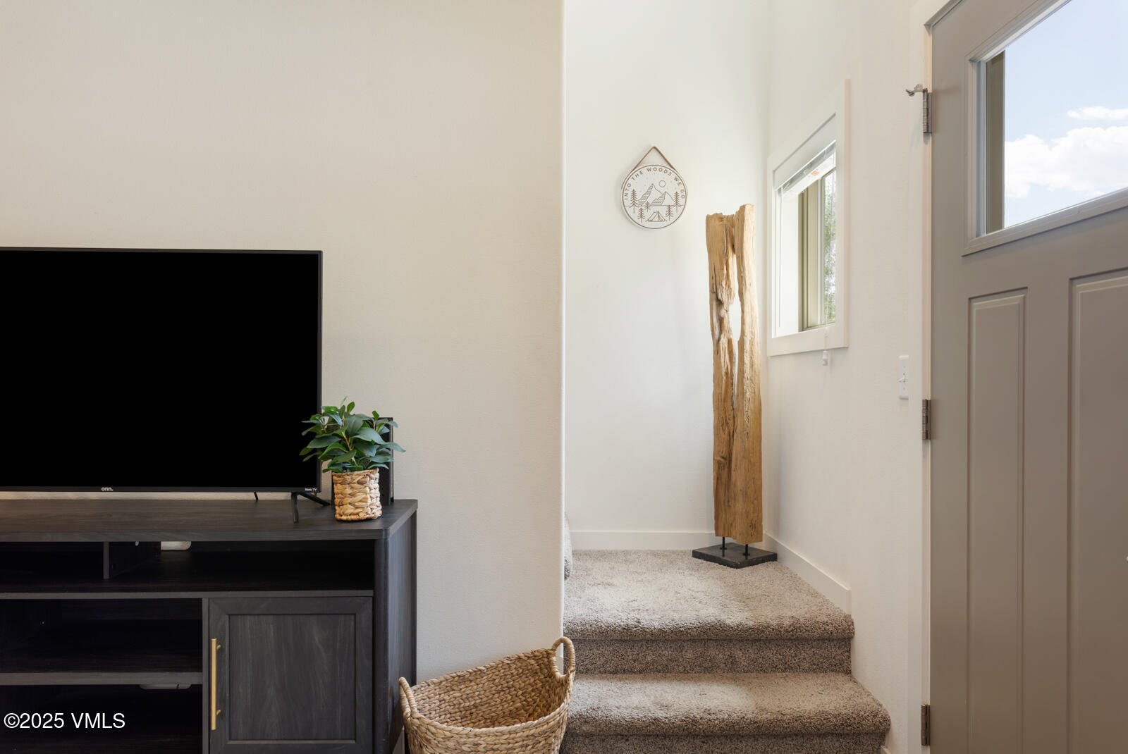 4 Uneva Court, Unit B1 Eagle, CO 81631 - Photo 15 of 44 a living room with furniture and a flat screen tv