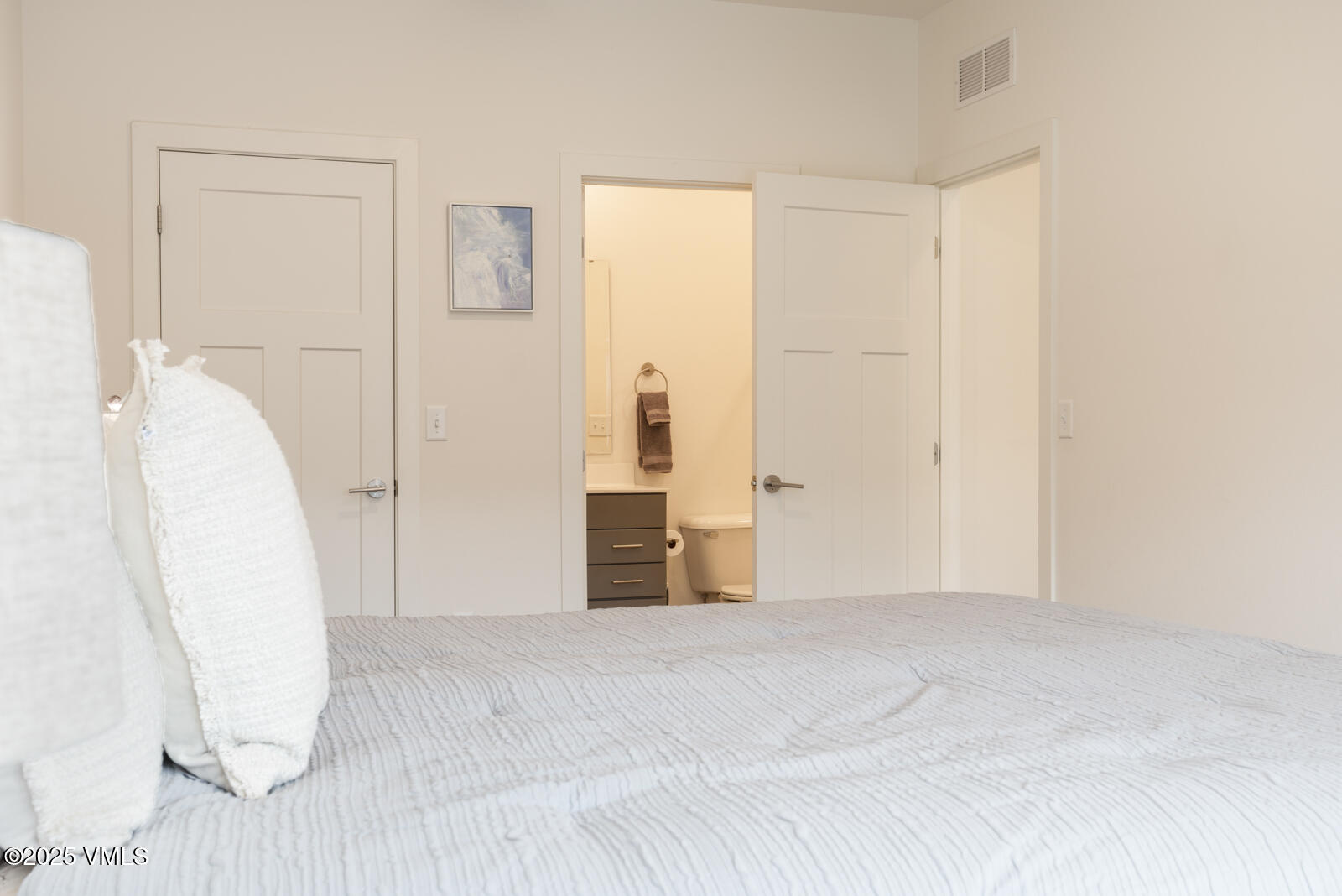 4 Uneva Court, Unit B1 Eagle, CO 81631 - Photo 18 of 44 a view of a room with wooden floor and white walls