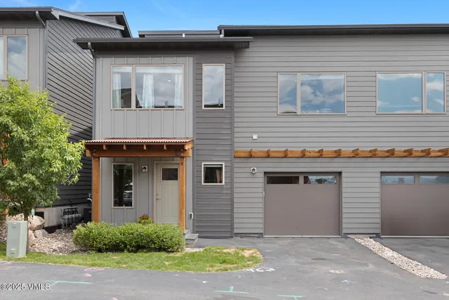 a front view of a house with a garage
