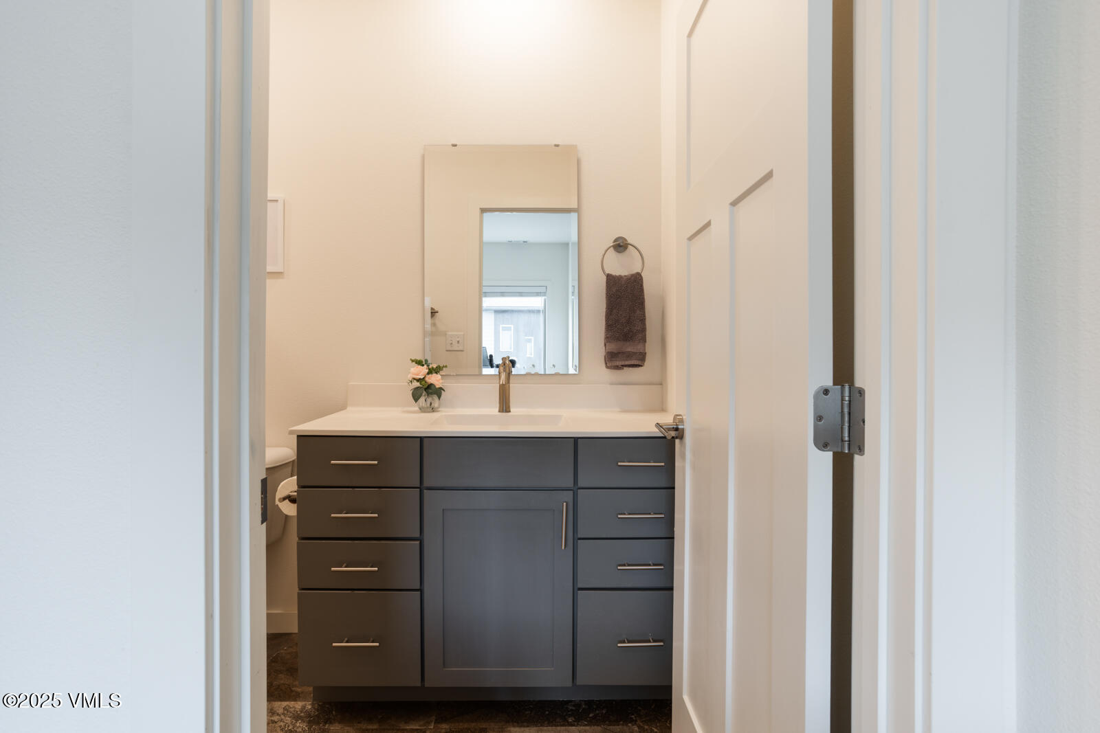 4 Uneva Court, Unit B1 Eagle, CO 81631 - Photo 23 of 44 a bathroom with a sink vanity and a mirror