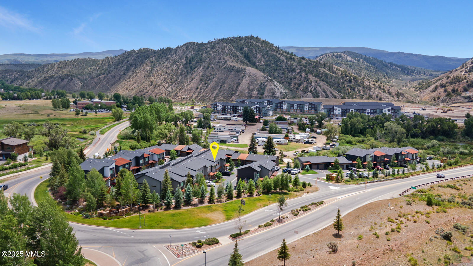 4 Uneva Court, Unit B1 Eagle, CO 81631 - Photo 27 of 44 a view of a swimming pool with a yard and mountain view