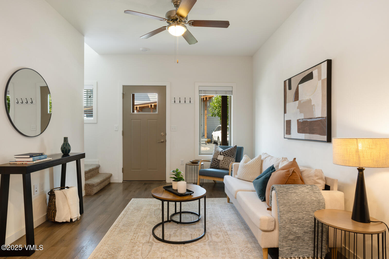 4 Uneva Court, Unit B1 Eagle, CO 81631 - Photo 3 of 44 a living room with furniture a lamp and a window