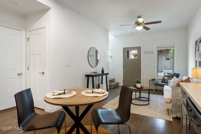 a view of a dining room with furniture and wooden floor