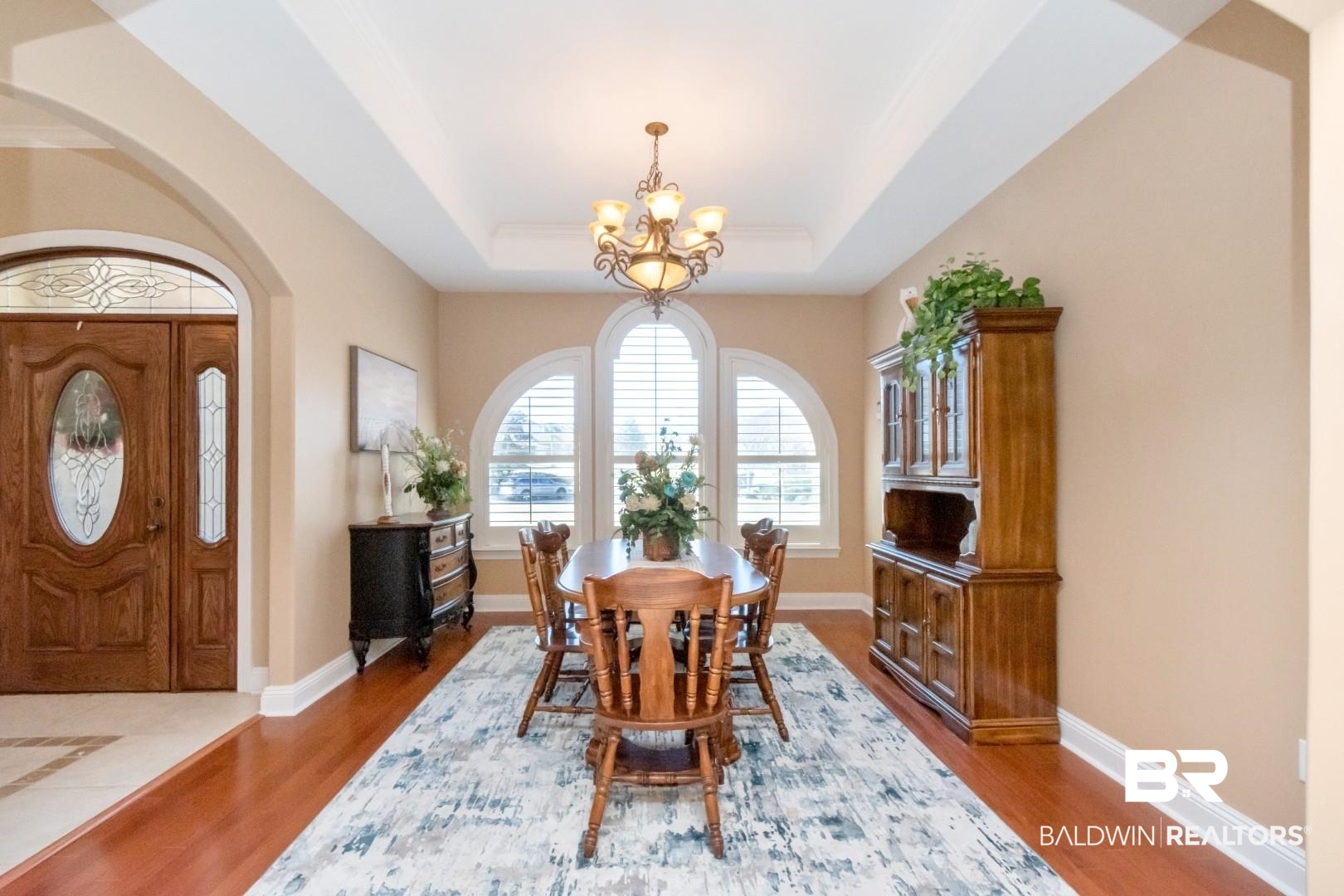 9905 Carnoustie Court Foley, AL 36535 - Photo 4 of 31 Dining room with a chandelier, wood finished floors, and arched walkways