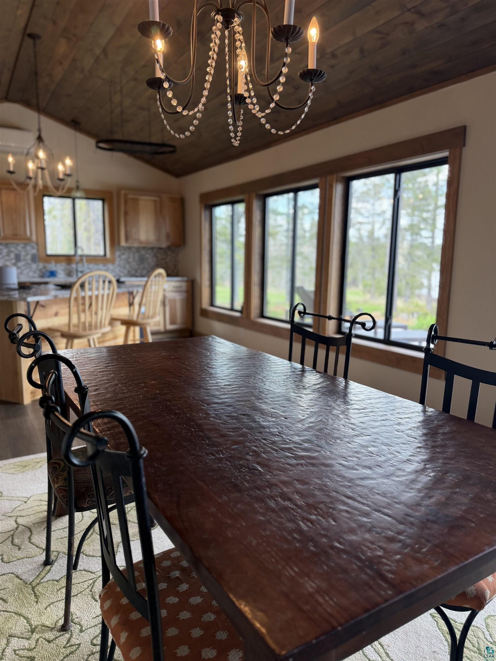 5274 Marble Lake Road Two Harbors, MN 55616 - Photo 11 of 79 Vaulted wood-finish ceiling featuring a chandelier with crystal-look accents