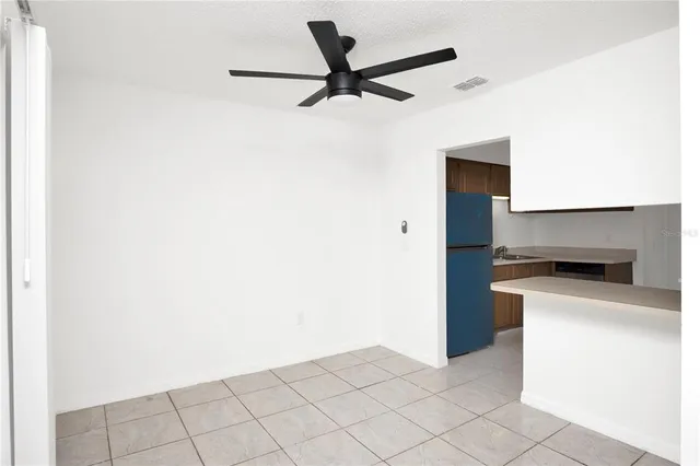 a kitchen with a sink cabinets and window