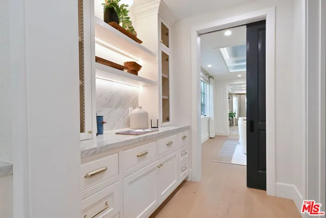 a spacious bedroom with a bed and a large window