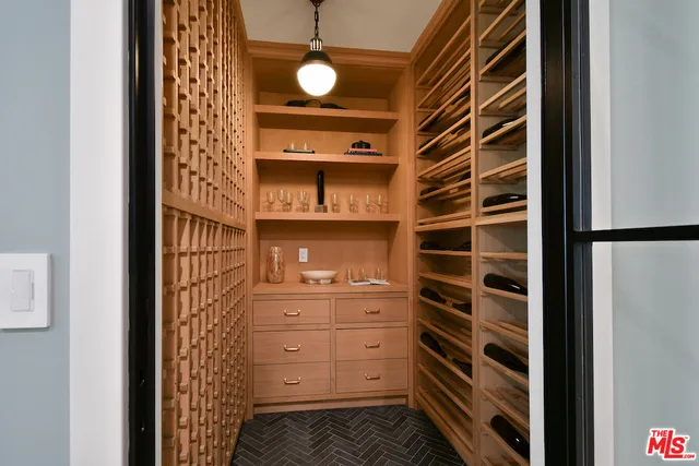 a spacious bedroom with a bed and a cabinets