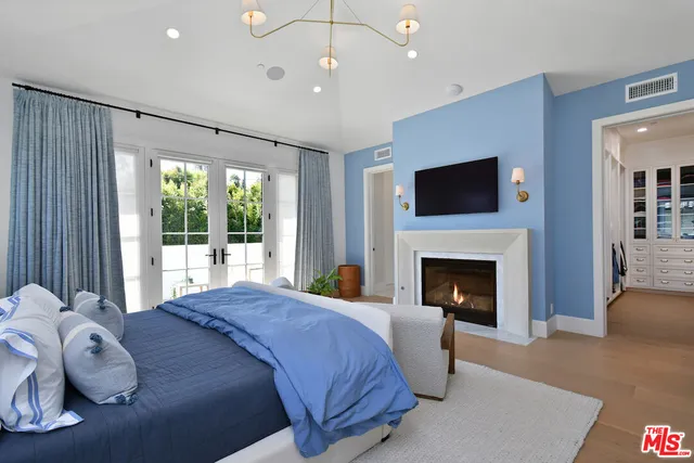 a white bath tub sitting in a bathroom next to a window