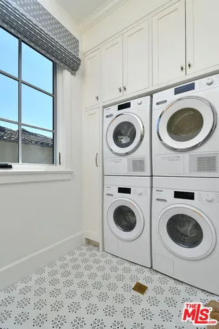 a front view of a house with a yard table and chairs