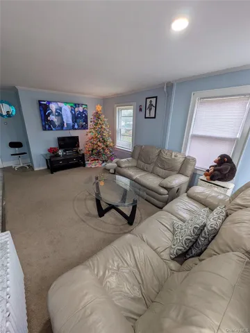 a bedroom with two beds and a couch