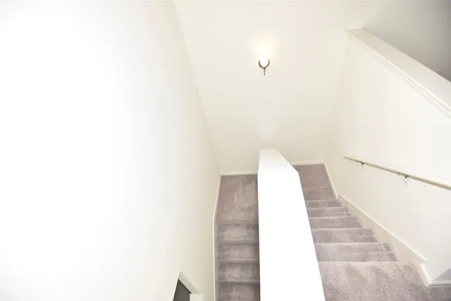 a view of a hallway with white walls