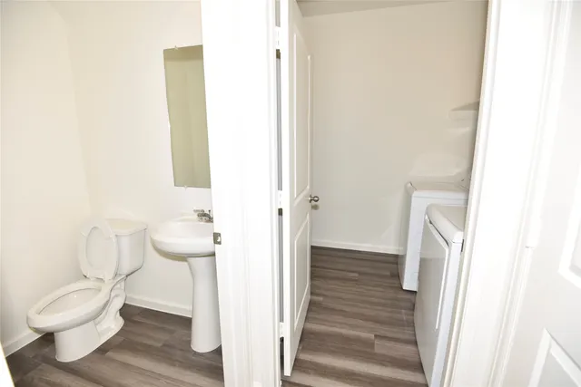 a bathroom with a toilet a sink and a shower