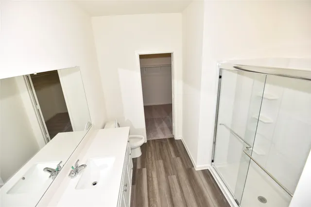 a bedroom with a bed and a mirror