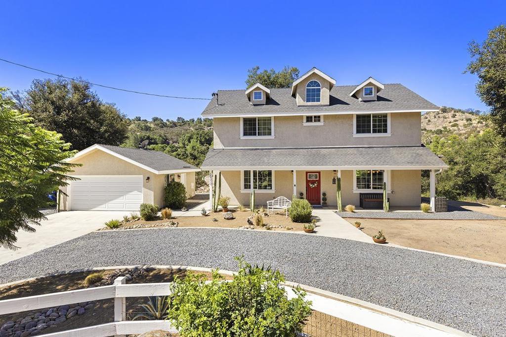 30610 Lilac Road Valley Center, CA 92082 - Photo 1 of 1 a front view of a house with a yard