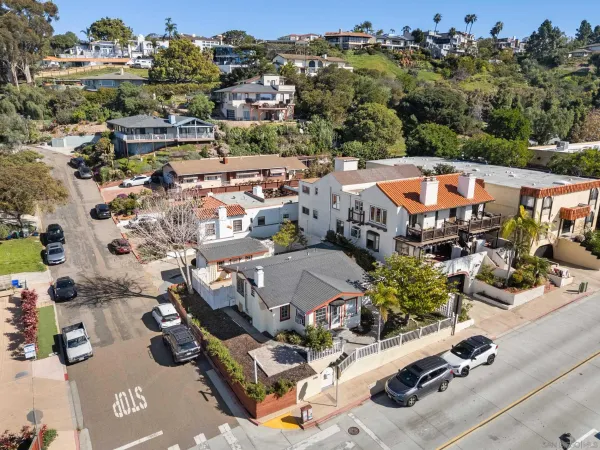 an aerial view of a houses with yard