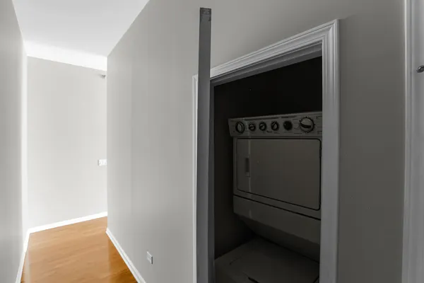 a room with a door and a stove