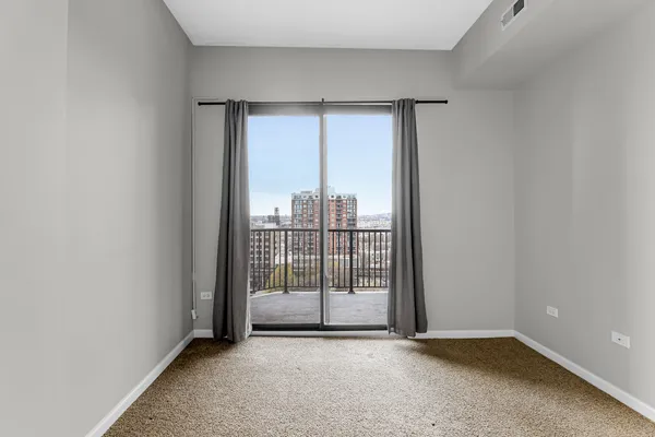 a view of a room with sliding glass door