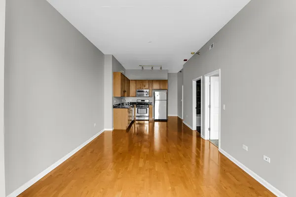 a view of a kitchen with a sink and cabinets