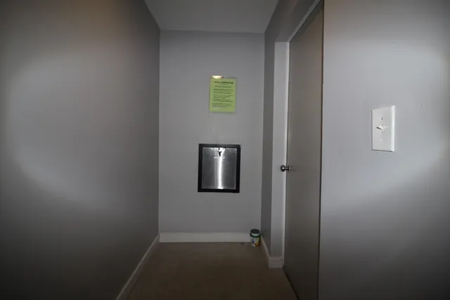 a big yard with lots of green space and fountain