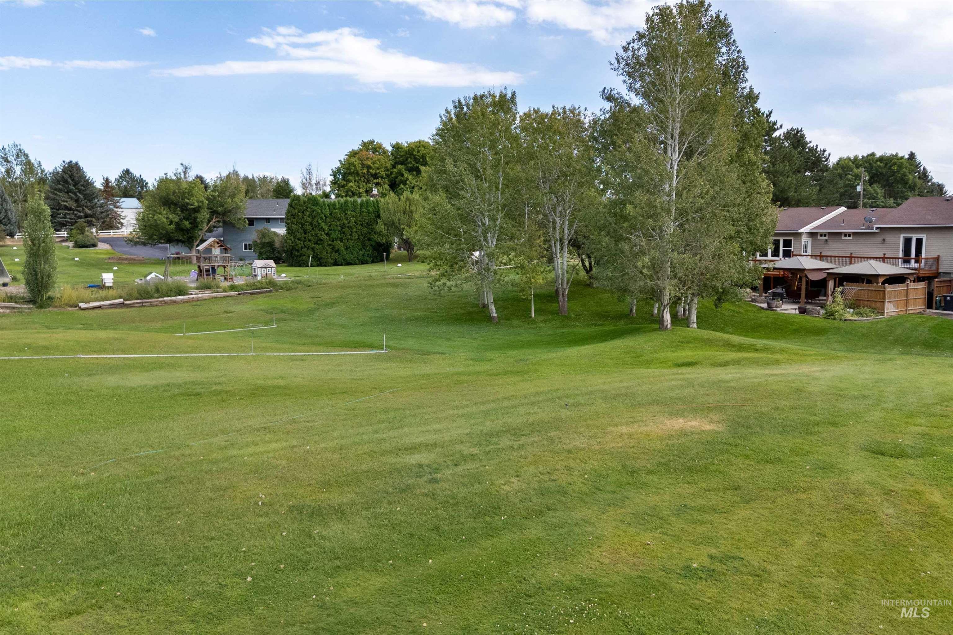 216 Ranch View Road West Jerome, ID 83338 - Photo 30 of 42 Expansive green space with natural landscaping and mature trees