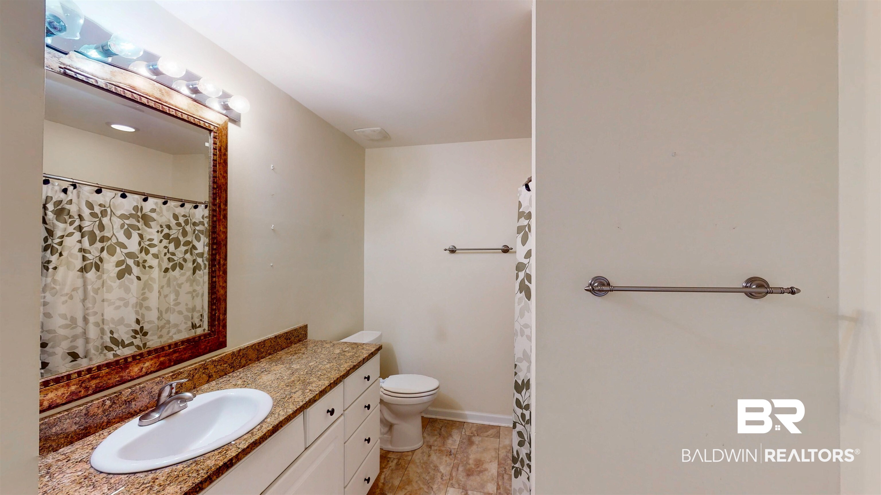 303 Wyld Palms Drive, Unit 303 Foley, AL 36535 - Photo 24 of 36 Bathroom with vanity and a shower with curtain