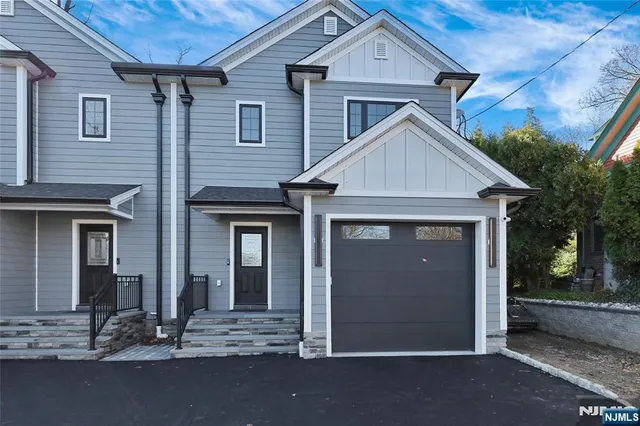 a view of a house with large windows