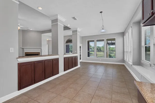 a large bathroom with a large tub and sink