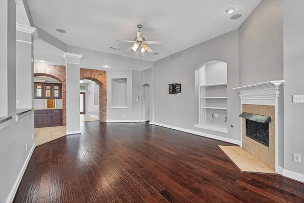 a kitchen with a sink a counter space appliances and cabinets